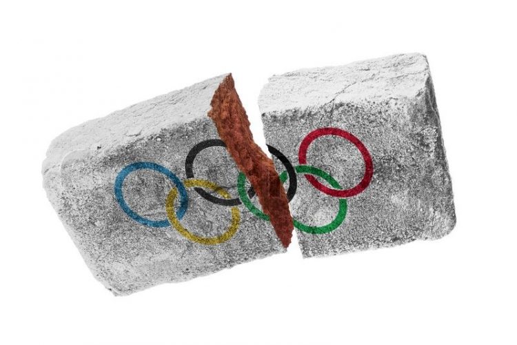 Gebroken baksteen met de Olympische ringen